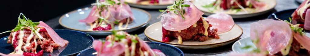 A variety of gourmet tapas presented beautifully in an upscale restaurant, highlighting culinary artistry.